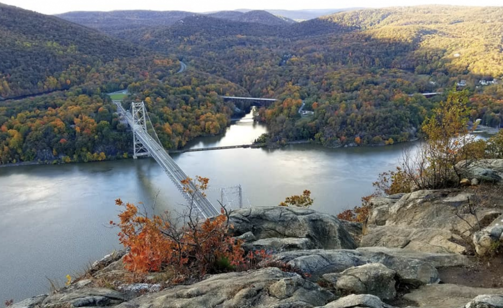 Bear Mountain aerial view of bridge, lake, and trees | Where to See Fall Foliage In and Around New York City