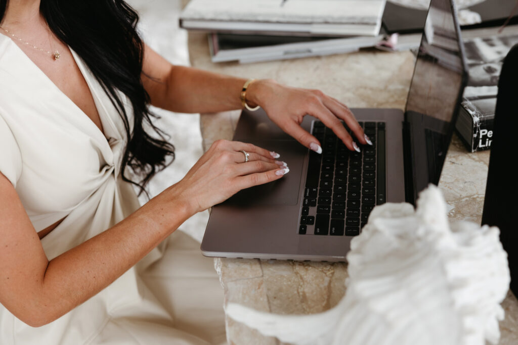 Entrepreneur creating an online course on a laptop