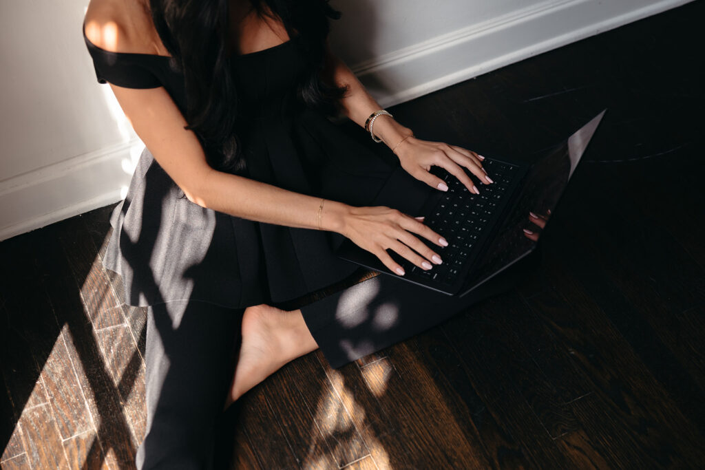 Woman optimizing SEO strategies on a laptop for enhanced website performance