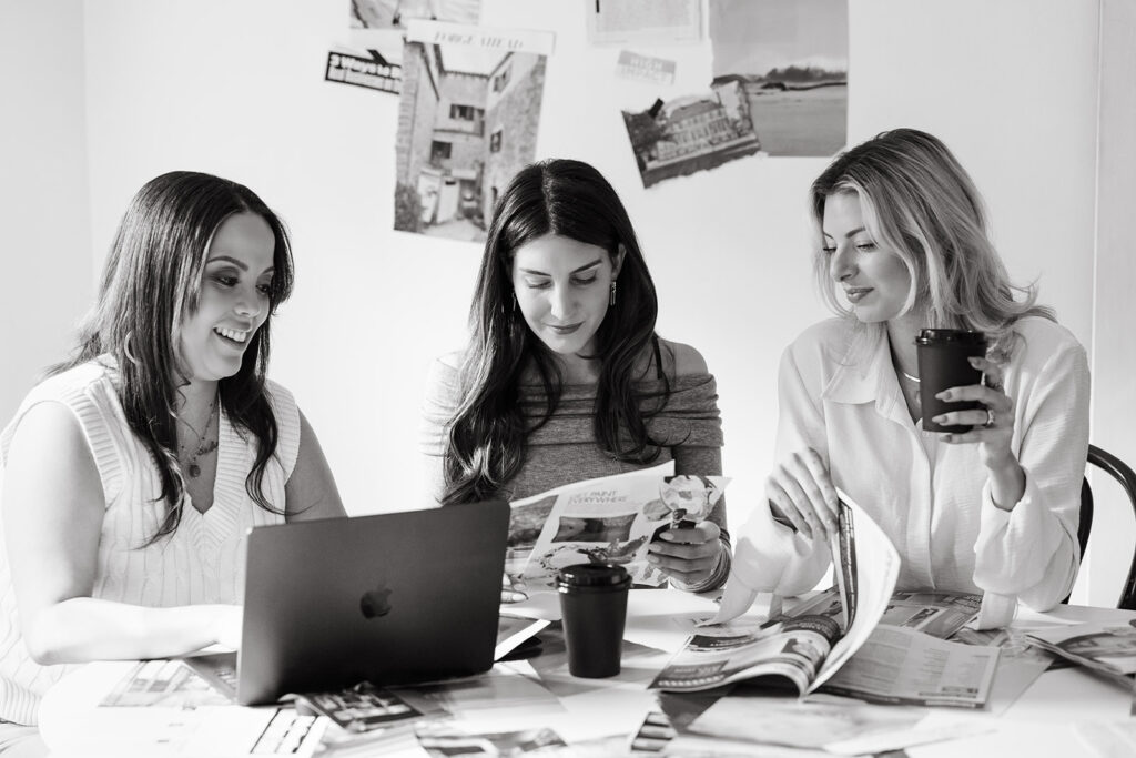 Group of women collaborating on SEO strategies using a laptop